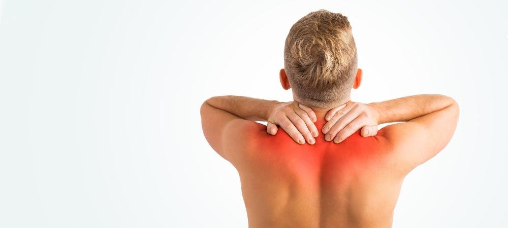 Man suffering from upper back pain.